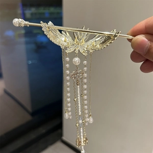 Elegant Chinese gold hair pin with wing design and long white pearl tassels for women