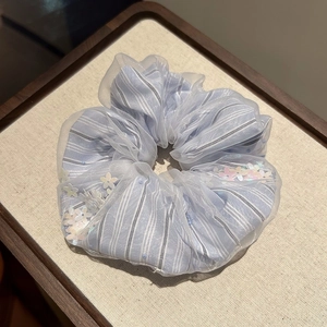 Light blue striped mesh scrunchie with sequins and floral details for hair styling