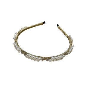 Baroque bow headband with pearls and rhinestones on elegant gold metal frame