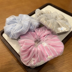 Three-piece set of floral sequin tulle scrunchies in pink, blue and brown tones
