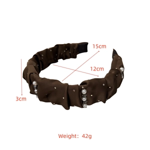 Detail view of coffee brown satin pleated headband with white pearls and rhinestones size info