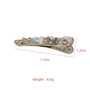 Detail shot of blue crystal hair clip measuring 7.7cm by 1.2cm and weighing 8.9g