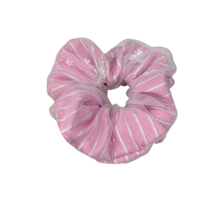 Pink striped fabric scrunchie with sheer white tulle, floral lace, and sequins
