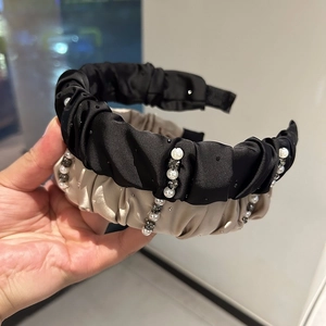 Elegant pleated satin headband with pearls and rhinestones in black and champagne gold colors
