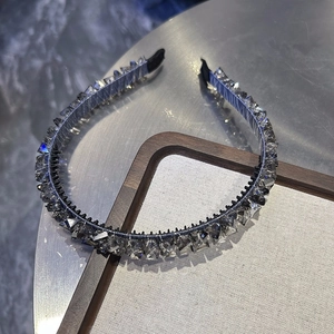 Detail of crystal headband showing multi-faceted stones and anti-slip inner teeth