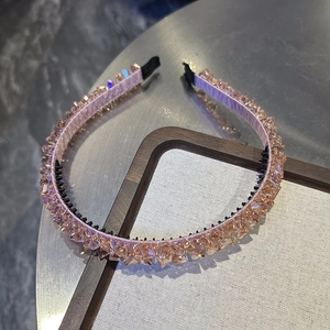 Detail of pink crystal beaded headband with anti-slip inner comb and silk fabric wrap