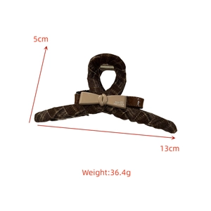 Detail view of 13cm brown tweed hair claw clip with cream resin bow and size dimensions
