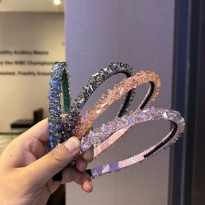 Detailed macro view of four beaded headbands with faceted crystal beads and non-slip inner bands