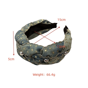 Detailed view of blue denim braided headband with gold stars and dimensions measurement
