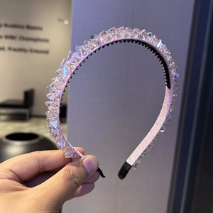 Detailed view of pink beaded headband with clear crystal spikes and anti-slip inner teeth