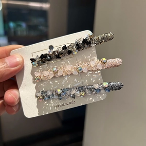 Three-piece handmade crystal hair clip set with sparkling beads in gold pink and blue