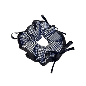 Checkered bow scrunchie in black white and blue with black satin ribbon trim