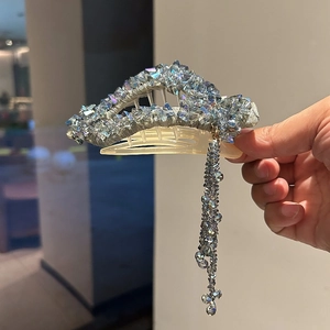Elegant crystal shark hair claw with blue floral tassel and shimmering rhinestone decor