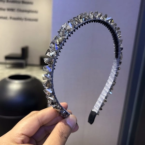 Detail of crystal headband showing sparkling geometric beads and anti-slip teeth design