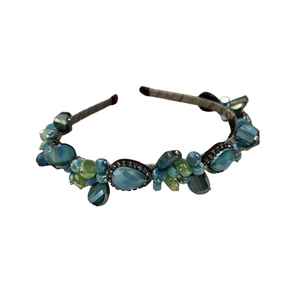 Elegant green and blue faceted crystal headband with a vintage luxury aesthetic