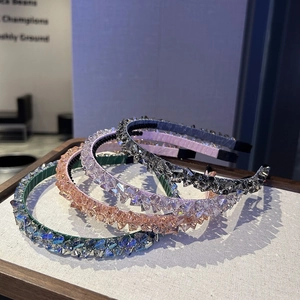 Detail of four colorful beaded headbands with crystal-like crushed ice texture on a tray