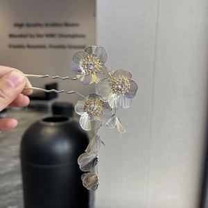 Elegant Chinese style metal hair fork with hollow mesh flowers and tassel pendant