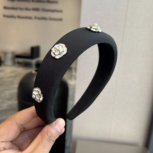 Elegant black padded headband with white camellia flowers and pearl accents for women