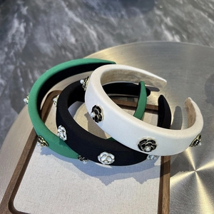 Three-piece sponge headband set with camellia flowers and pearls in green, black, and white