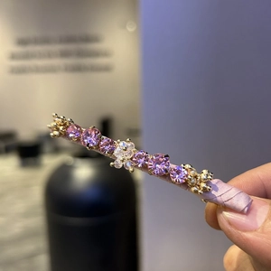 Handmade beaded hair clip with pink crystals and white flower on purple satin base