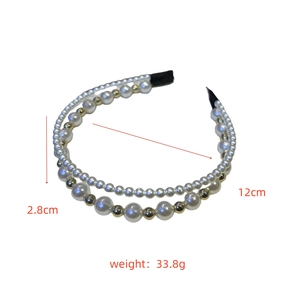 Detailed view of double-layered faux pearl headband with gold beads and size dimensions