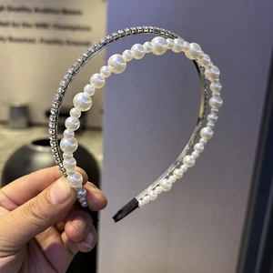 Double-layered headband with elegant white pearls and sparkling silver rhinestones