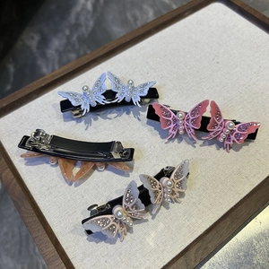 3D acetate butterfly hair clips with faux pearls and glitter in blue, pink, and beige