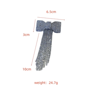 Detail showing dimensions of silver rhinestone bow hair clip with long tassel fringe