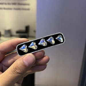 Elegant velvet hair clip with iridescent heart rhinestones and sparkling crystal border