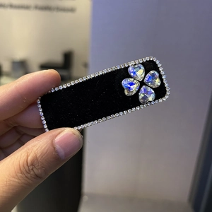 Elegant black velvet rectangular hair clip with rhinestone border and crystal clover heart