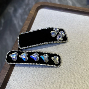 Luxurious black velvet hair clips with rhinestone borders and colorful crystal hearts