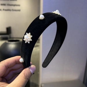 Elegant black velvet headband with white pearls and sparkling rhinestone floral details