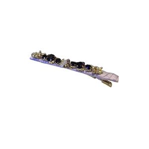 Handmade beaded crystal hair clip featuring purple gemstones and lavender satin fabric