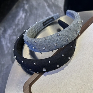 Detailed view of handmade padded headbands with silver beads and sparkling rhinestones