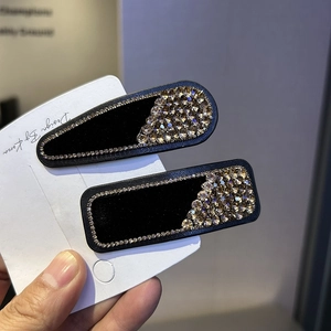 Velvet hair clips with sparkling gold rhinestones in teardrop and rectangular shapes
