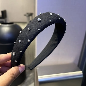 Elegant black padded sponge headband decorated with silver beads and sparkling rhinestones