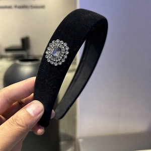 Elegant wide black velvet headband with luxury crystal gemstone embellishment