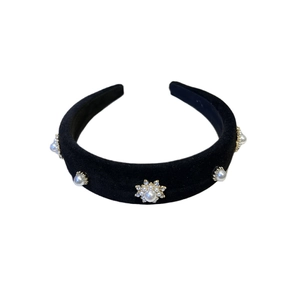 Elegant black velvet baroque headband with pearls and rhinestones on white background