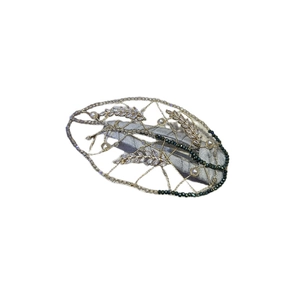 Elegant hand-woven leaf hair clip with pearls and green beads on white background