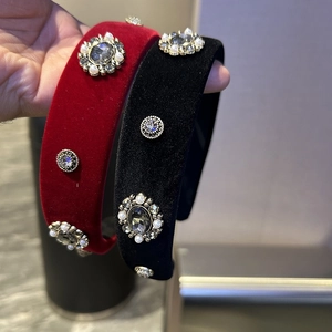 Detail of velvet headbands in burgundy and black with crystal and pearl vintage accents