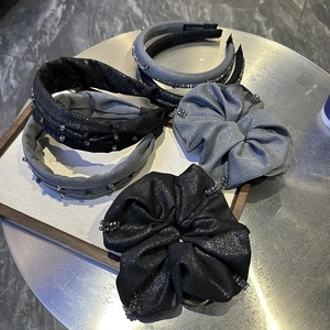 Detailed set of grey beaded headbands and fabric scrunchies with elegant glitter and rhinestones