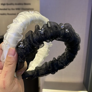 Elegant beaded pleated tulle headbands in black and white for a sophisticated hairstyle