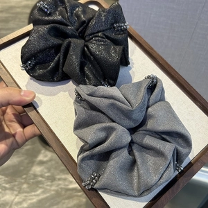 Elegant metallic scrunchie set with beaded edges in black and silver grey silk fabric