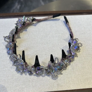 Detailed view of purple satin headband with iridescent crystal beads and non-slip inner teeth