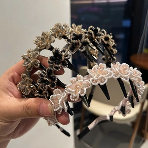 Detail of beaded crystal flower headbands with tooth comb in pink and black gold