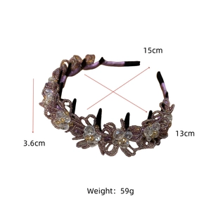Detail of purple lace flower headband with crystal beads and toothed black base frame
