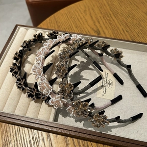 Detail of beaded flower headbands with double layer hair clips in three elegant colors