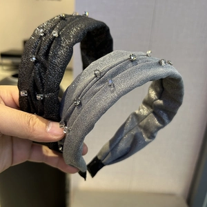 Elegant grey and black pleated headbands with glittering fabric and sparkling rhinestones