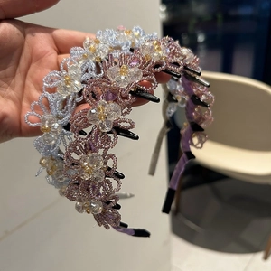 Detail of handmade beaded flower headband with non-slip hair comb teeth for women