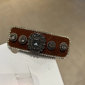 Vintage brown velvet hair clip with a large emerald-cut grey crystal and rhinestones
